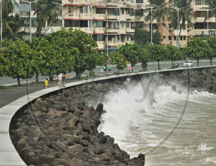 Sea waves strike at Marine Drive during rains, in Mumbai on June 18, 2020.