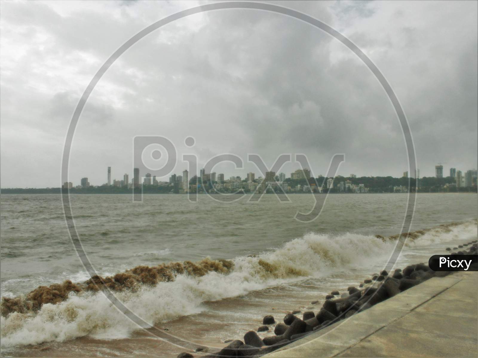Sea waves strike at Marine Drive on an overcast day, in Mumbai on June 18, 2020