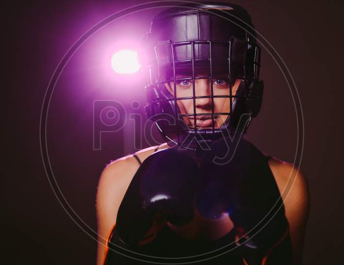 Sexy Woman Fighter In Boxing Gloves And Headgear Portrait