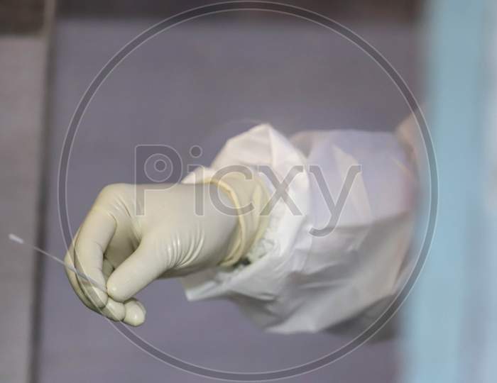 A Health Worker Collects The  Swab Sample For Covid-19 Ag Rapid Antigen Testing, At A Dispensary In New Ashok Nagar, On June 23, 2020 In New Delhi, India.