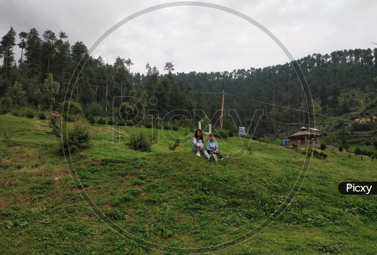 children relaxing in the green meadow of Bhaderwah