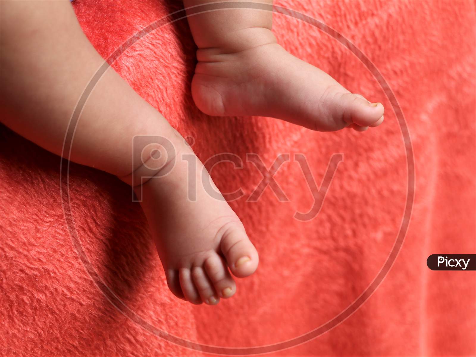 Cute leg of a child on velvet sheet