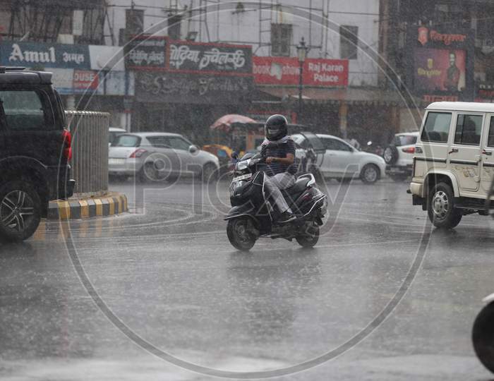 A Man Rides Scooty On The Road During Heavy Monsoon Rain In Prayagraj, June 25, 2020
