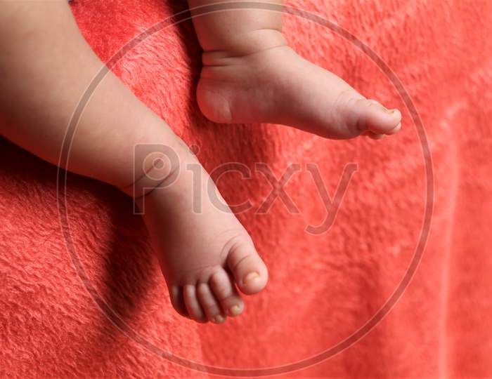 Cute leg of a child on velvet sheet