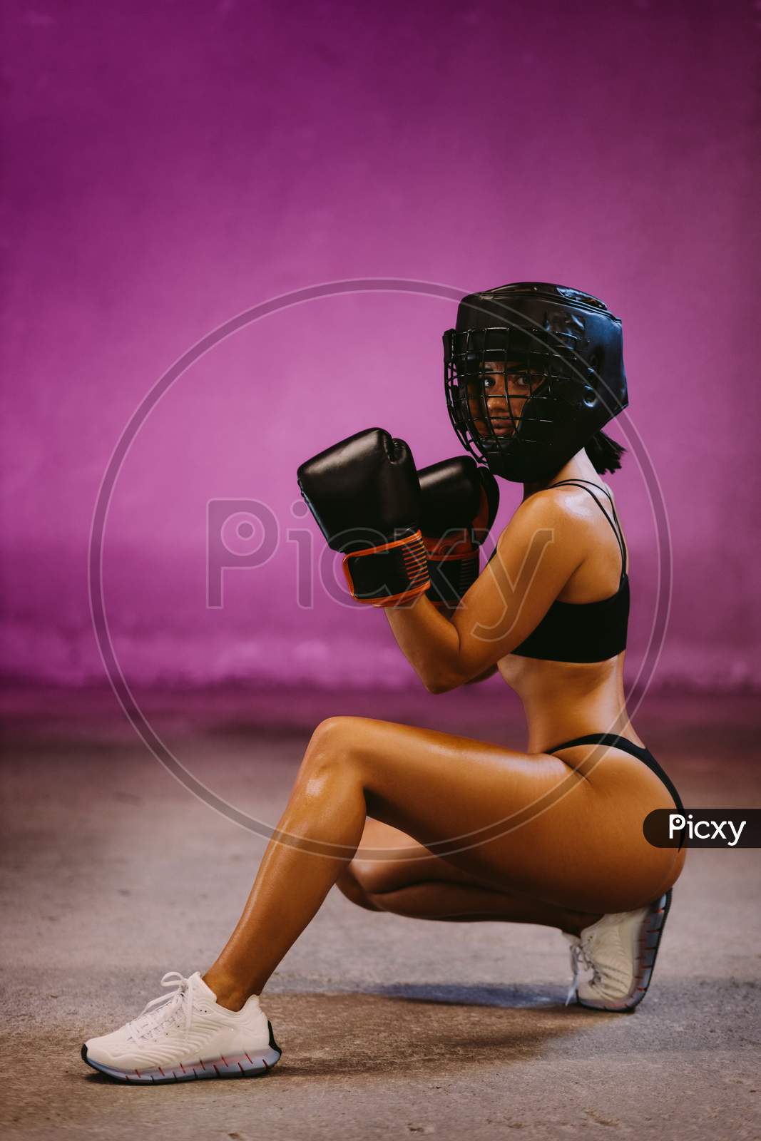 Beautiful Woman Fighter In Boxing Gloves Posing