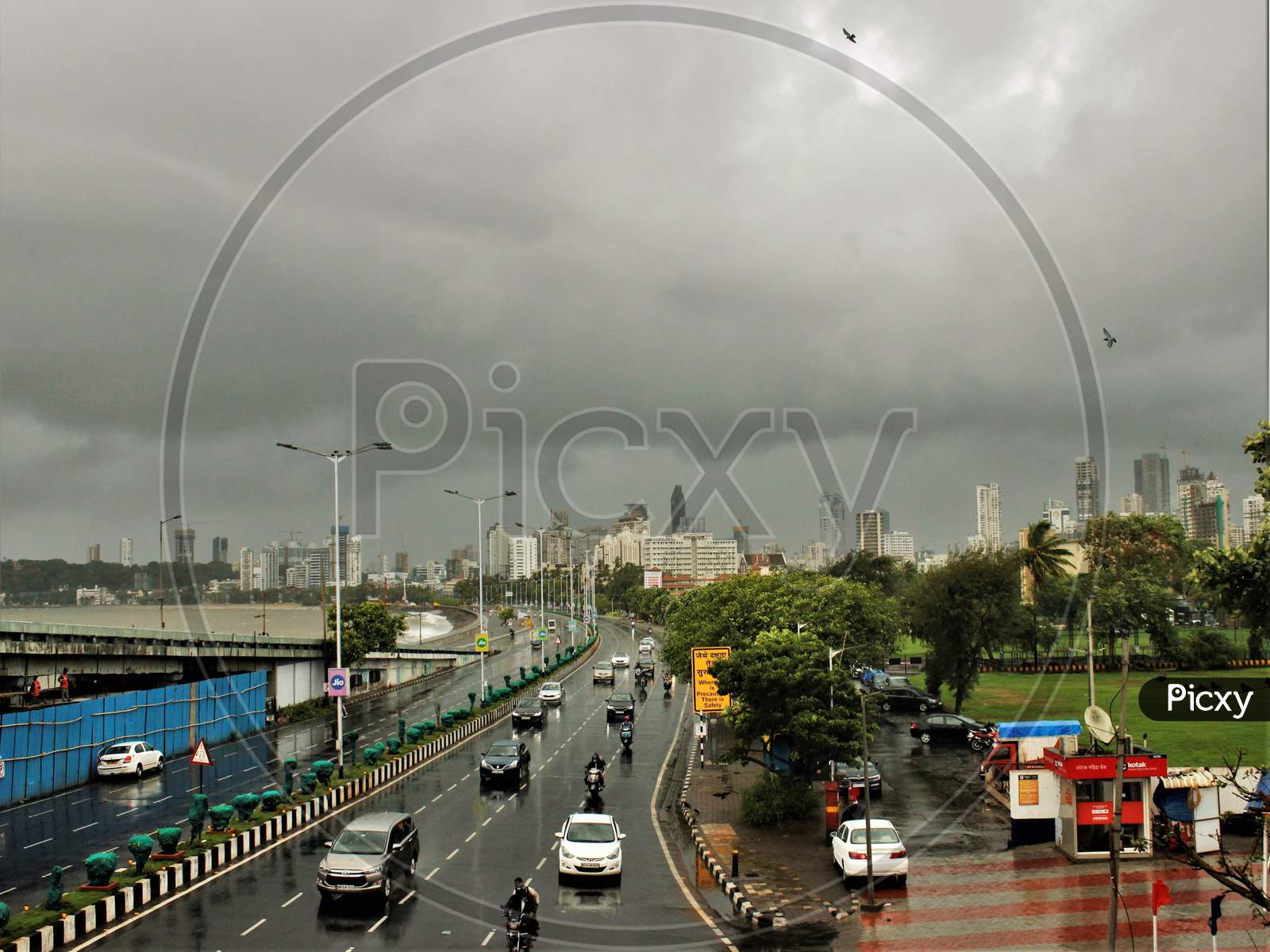 A general view shows dark clouds lingering over the city's skyline at Marine Drive during heavy rains, in Mumbai, India on June 18, 2020.