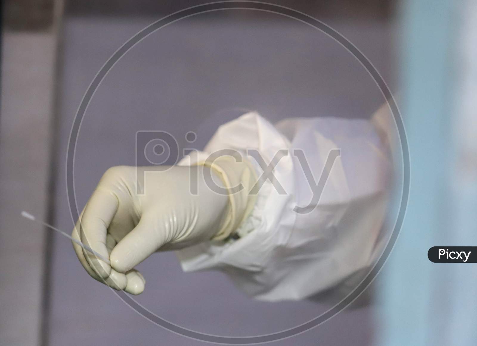A Health Worker Collects The  Swab Sample For Covid-19 Ag Rapid Antigen Testing, At A Dispensary In New Ashok Nagar, On June 23, 2020 In New Delhi, India.