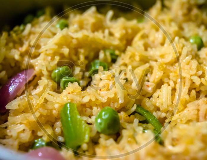 Homemade Chinese fried rice with vegetables, Veg Schezwan Fried Rice, peas, peppers, green beans, carrot. Selective Focus, Top view