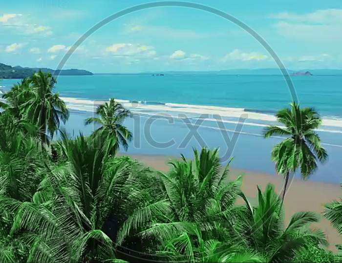 tropical beach with white sand and blue sky With palm tree