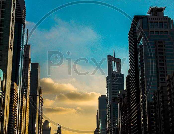 Symmetrical Photo Of Dubai, United Arab Emirates, Skyline Around Golden Hour