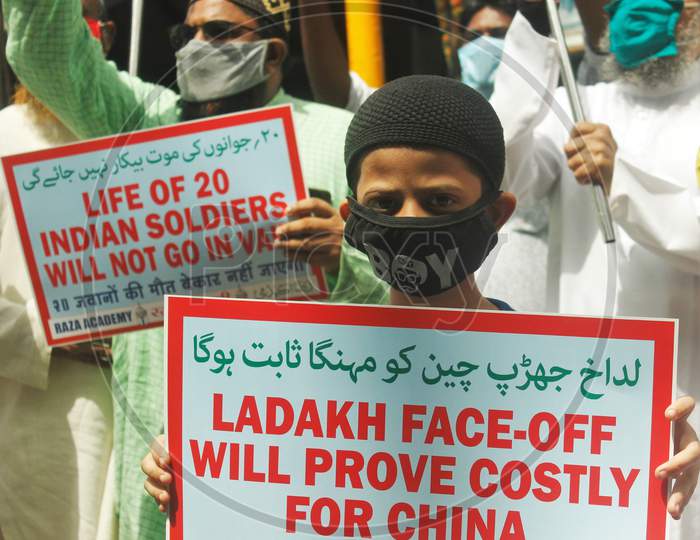 Demonstrators wearing protective masks take part in a protest to condemn the killing of 20 Indian Soldiers over the Ladakh clash with China, in Mumbai, India on June 20, 2020.