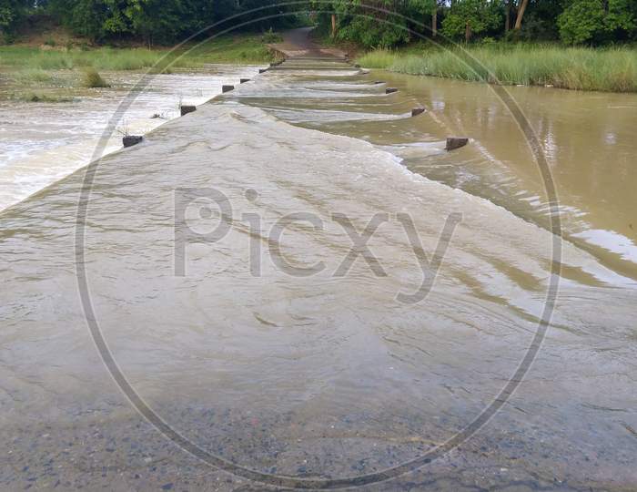 River Water Rising Over Road In Flooded Situation