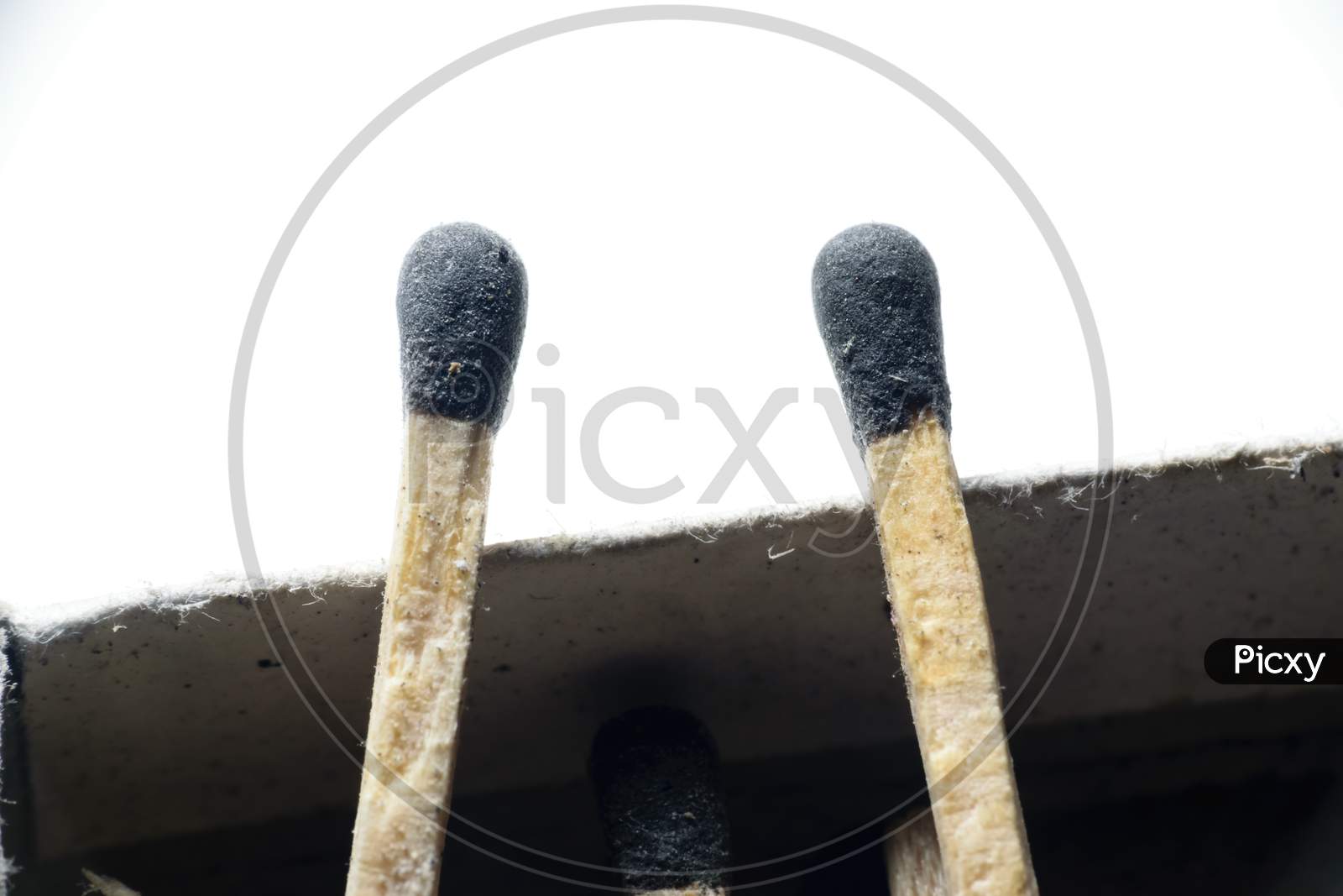 Two Match Sticks Kept Side By Side In A White Background