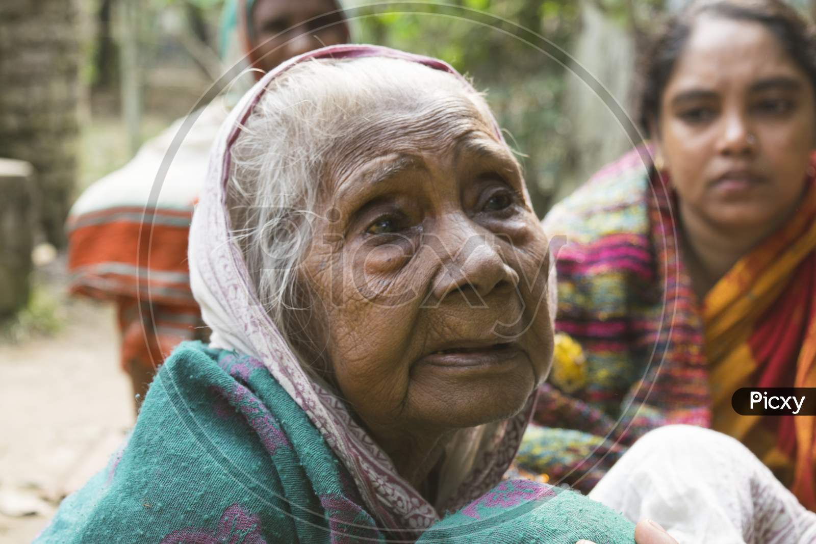 A Indian old lady gathering with relatives