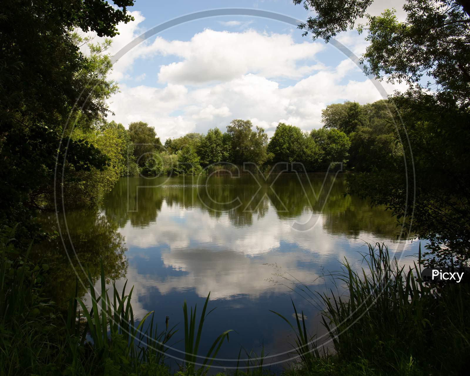 Lake Reflection Of Cloudy Blue Sky - Spring, Summers Season In England. Concept Of Tranquility And At One With Nature. Horizontal