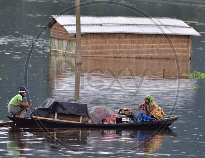 Flood Affected Villagers Are Transported On A Boat Towards A Safer Place At Bandardubi Village Near Kaziranga In Assam on June 26,2020