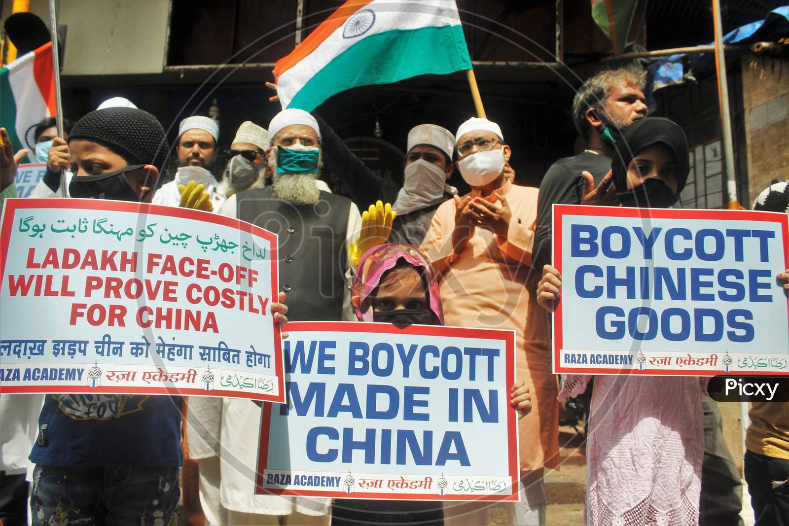 Demonstrators wearing protective masks take part in a protest to condemn the killing of 20 Indian Soldiers over the Ladakh clash with China, in Mumbai, India on June 20, 2020.