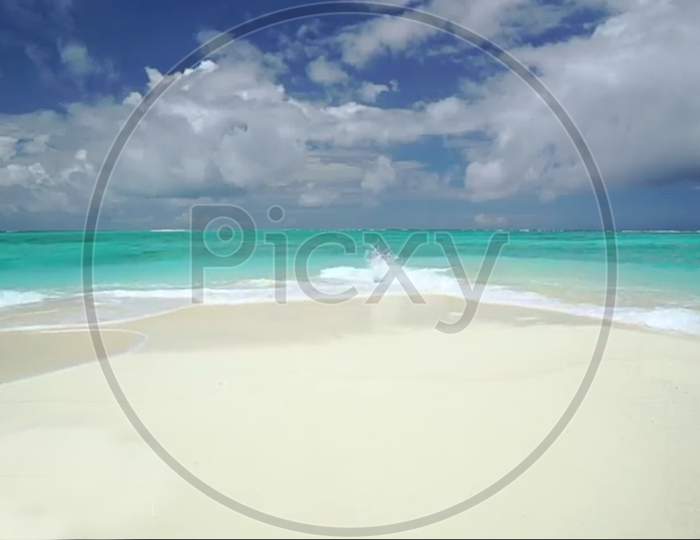 tropical beach with white sand and blue sky