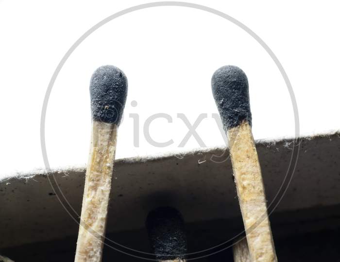 Two Match Sticks Kept Side By Side In A White Background