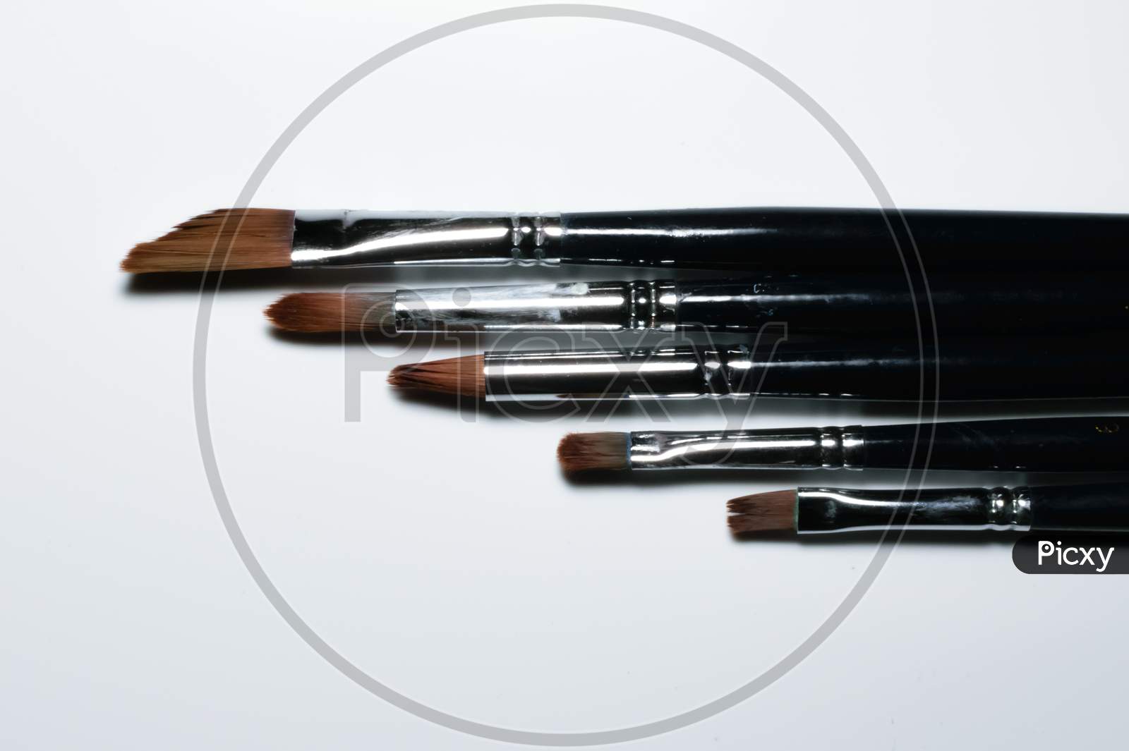 Painting Brushes Are Kept Side By Side In Descending Order. White Background