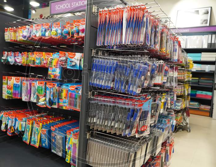 Pens In Their Packages Hanging For Sale In Store. Pens In Stationary Store. Writing Supplies. Colorful Beautiful Pen Shelves In Office Supply Store - Dubai Uae December 2019
