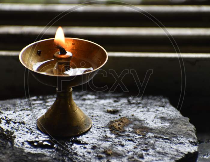 burning candle in the temple