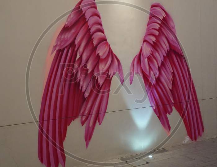 Dubai Uae December 2019 Pink Wings On Wall. Large Human Sized Pink Angel Wings Painted. Painted Walls, Graffiti Art, And Sculptures Adorn The Streets.