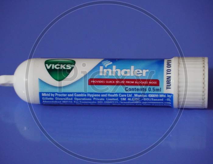 Tube Of Vicks Vapo Inhaler On An Isolated Blue Background. A 0.5 Ml Vicks Inhaler Tube Isolated. : Dubai Uae - March 2020