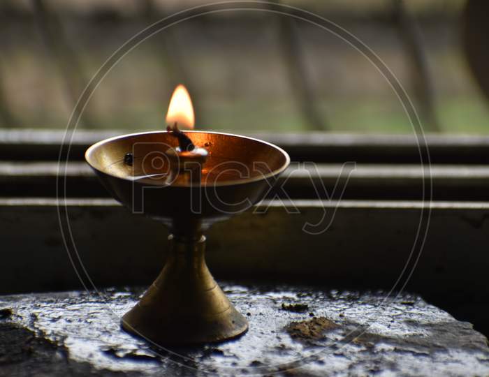 burning candle in the temple