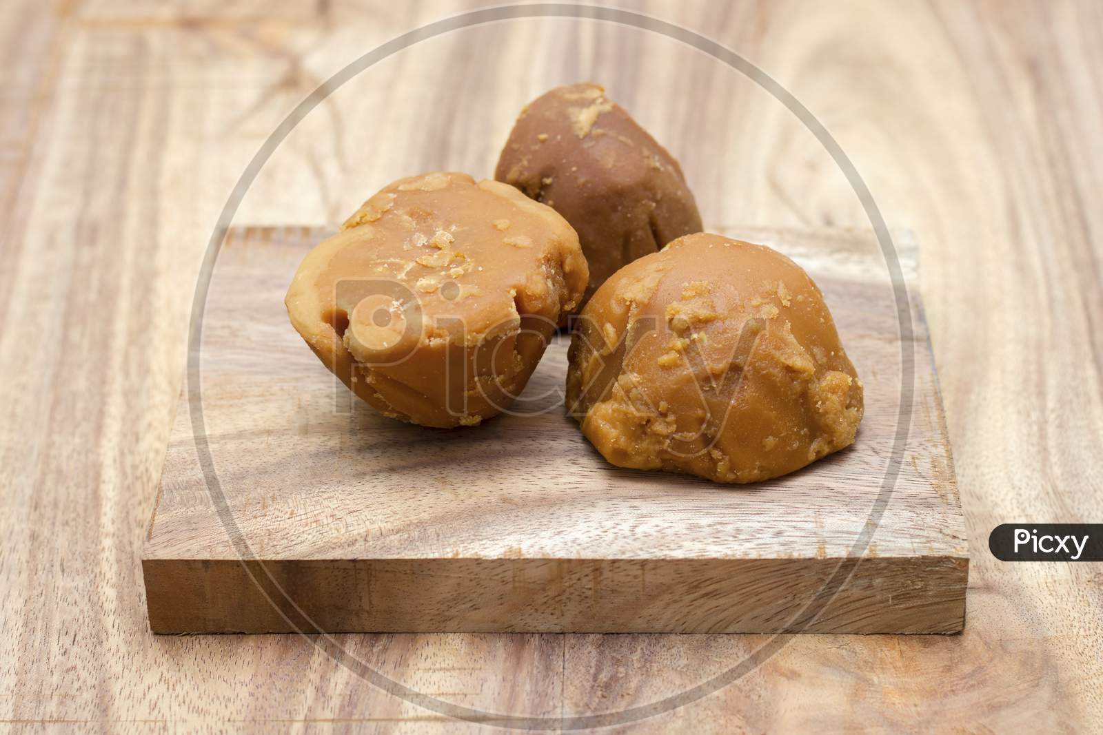 sweet and delicious Jaggery,decorated with wooden background