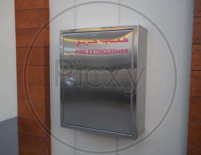 Container With A Fire Extinguisher. Wall Mounted Emergency Steel Metal Storage Box On A Wall.