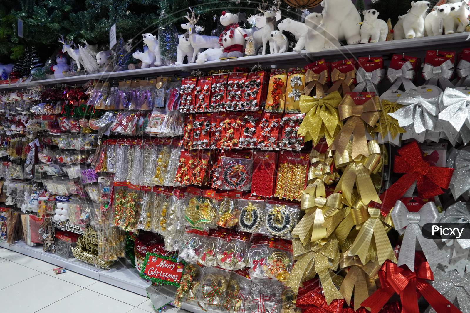 Christmas Market. Christmas Decoration Shelves Filled With Tree Ornaments, Shiny Baubles, Gift Stockings, Antler Headbands, Novelty Decorations, Signs & Festive Animals - Dubai Uae December 2019