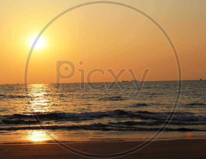 orange sunset sky and sun at Mairamar Beach, Goa