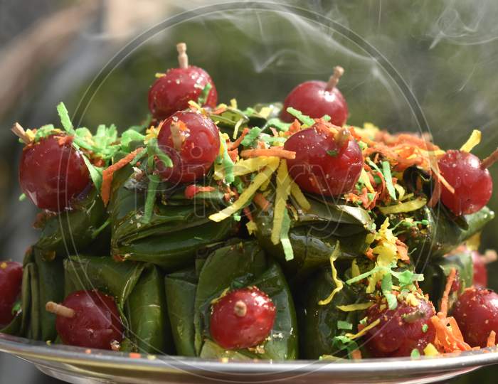 A Closeup Photograph Of Paan Or Betel Leaves Garnished With Jellies.