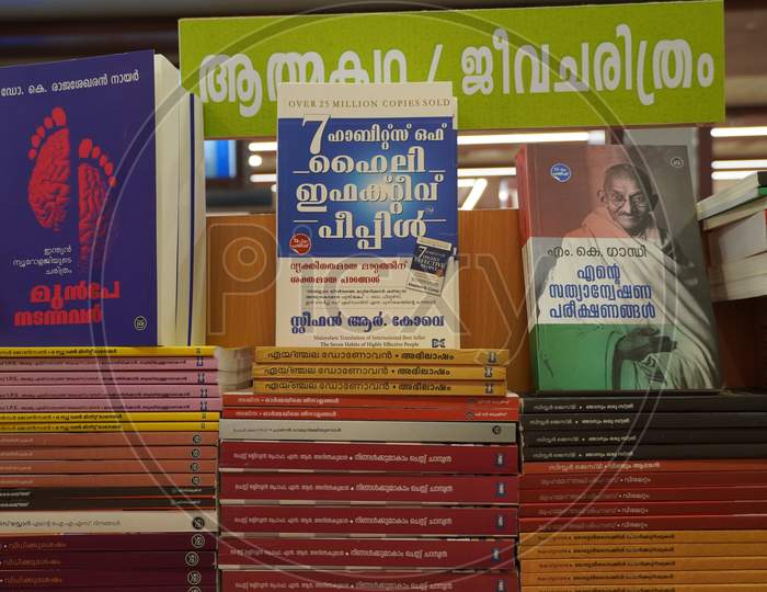 A Set Of Malayalam Novels Displayed In A Book Store. A Shelf Full Of Old And New Malayalam Books - Kochi, Kerala: 18 February 2020