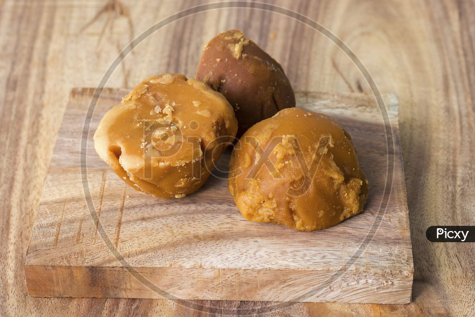 sweet and delicious Jaggery,decorated with wooden background