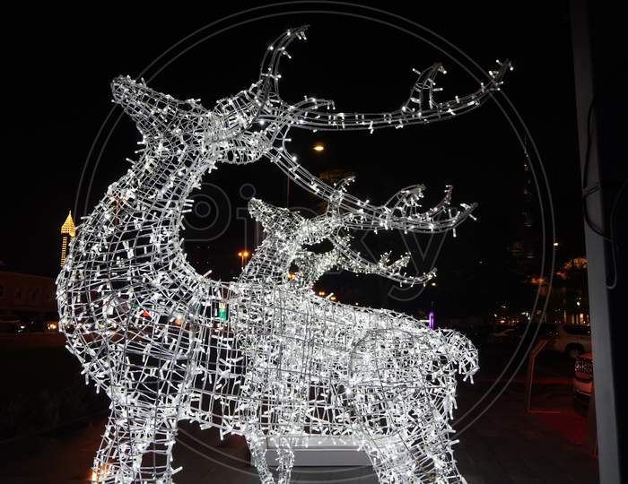 Glowing Reindeer Made Of Wire And Light Bulbs. Christmas Decorations. Christmas Lights On Reindeer Shape Wire Frame Mesh. Deer Christmas Outdoor Decoration. Decorative Lights- Dubai Uae December 2019
