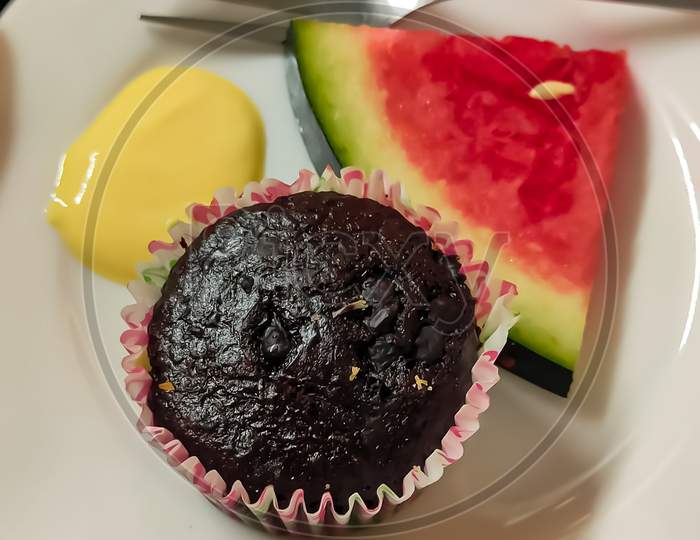 Healthy breakfast time with Chocolate Cup Cake,Watermelon, Mango curd.