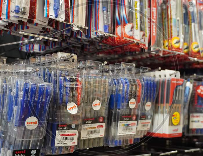 Pens In Their Packages Hanging For Sale In Store. Pens In Stationary Store. Writing Supplies. Colorful Beautiful Pen Shelves In Office Supply Store - Dubai Uae December 2019