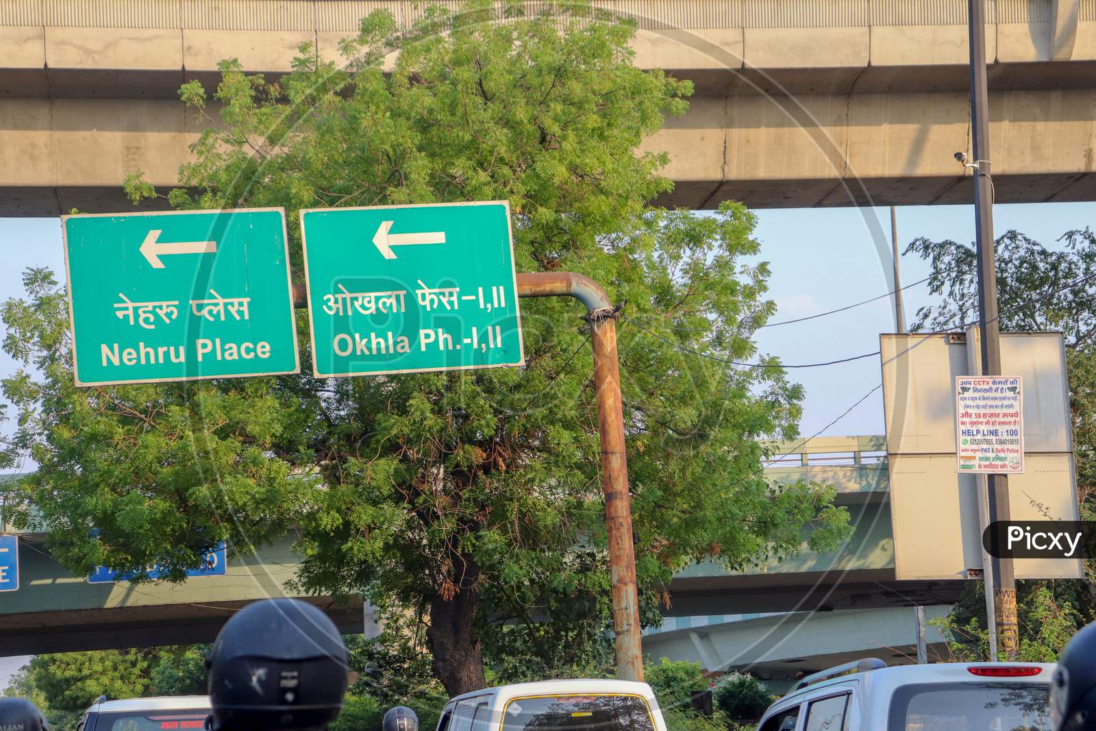 "New Delhi/India-21.06.2020: traffic sign Boards Direction from Nehru place and ohkla Ph I,II  near Tree Car , and Traffic Light "