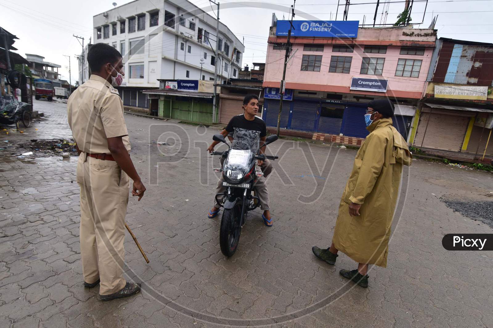 Police Questions Commuters Who Defied Curfew During  Lockdown, In The Wake Of Coronavirus Pandemic, In Nagaon District Of Assam On June 27,2020. Authority Announced The Imposition Of A Weekend Lockdown In All Urban Areas Of The State.
