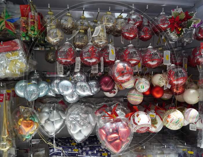 Dubai Uae December 2019 Beautiful Multicolored Christmas Balls In Christmas Market. Sale Of Christmas Decorations And Baubles In The Store. Christmas Ornaments Are In Plastic Boxes With Prices To Buy.