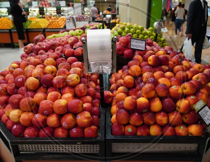 Bunch Of Red Apples On Boxes In Supermarket. Apples Being Sold At Public Market. Organic Food Fresh Apples In Shop, Store - Dubai Uae December 2019