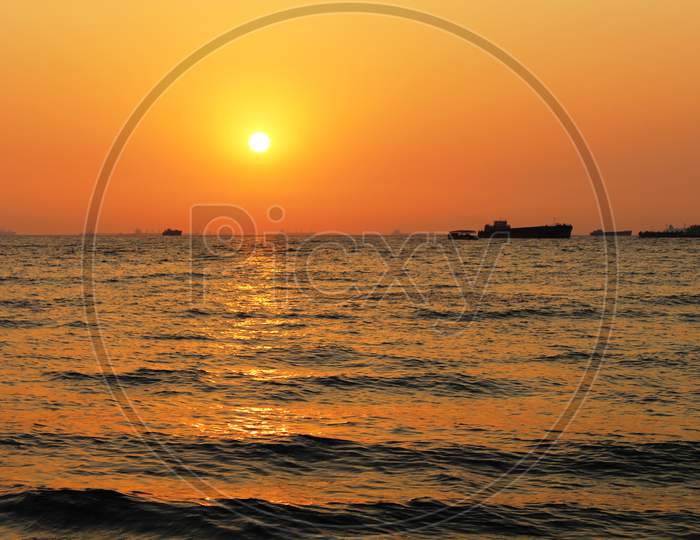 orange sunset sky and sun at Mairamar Beach, Goa