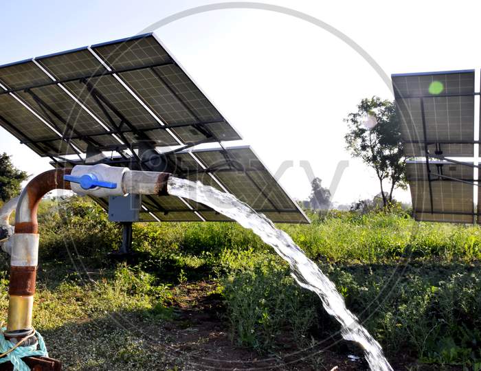 Agricultural Equipment For Field Irrigation, Water Jet, Behind Which Is Solar Panel'S,