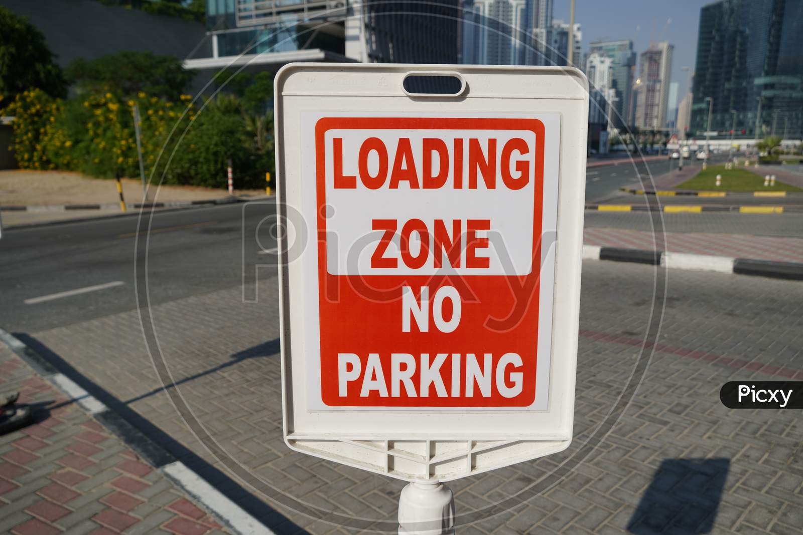 Dubai Uae December 2019 Red And White Sign For No Parking In The Loading Zone Outside A Building. Residential And Commercial Area With No Parking, Loading Zone Sign.