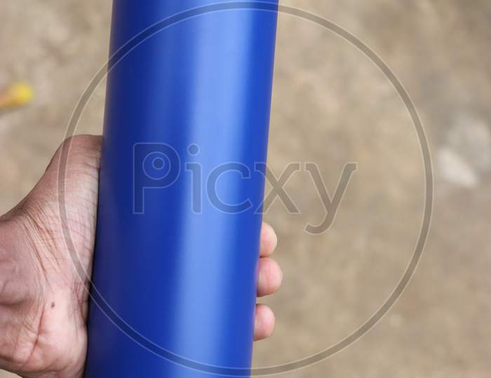 Steel Flask Used For Storing Water And Other Edible Fluids With Space For Branding Held In Hand