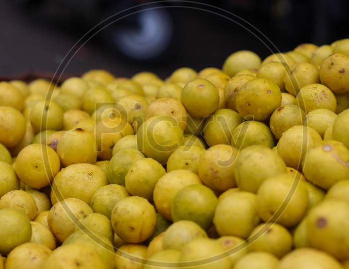 Lot Of Yellow Lemons In A Market