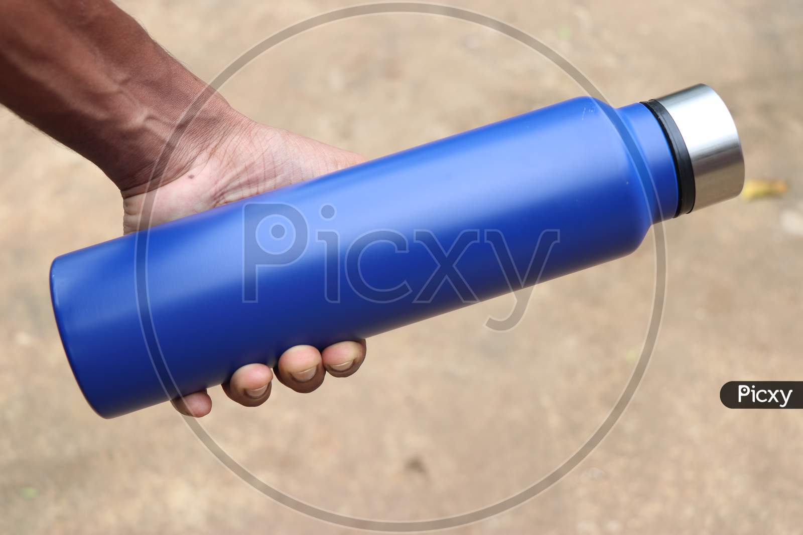 Water Flask Or Stainless Steel Water Bottle Held In Hand With Space For Branding