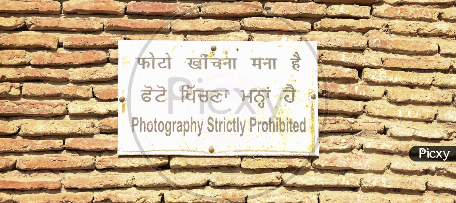 An Instruction Plate Stating 'Photography Strictly Prohibited'